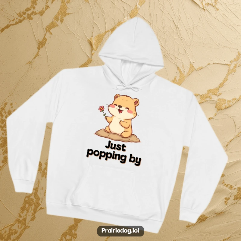 Funny hoodie showing a happy prairie dog popping its head out of its burrow, holding a cute little flower.