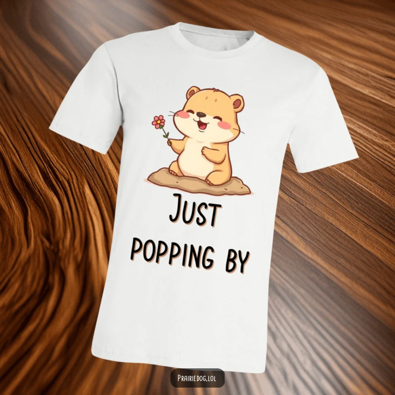 Funny t-shirt depicting a happy prairie dog emerging from its burrow with a tiny flower, a sweet and humorous scene.